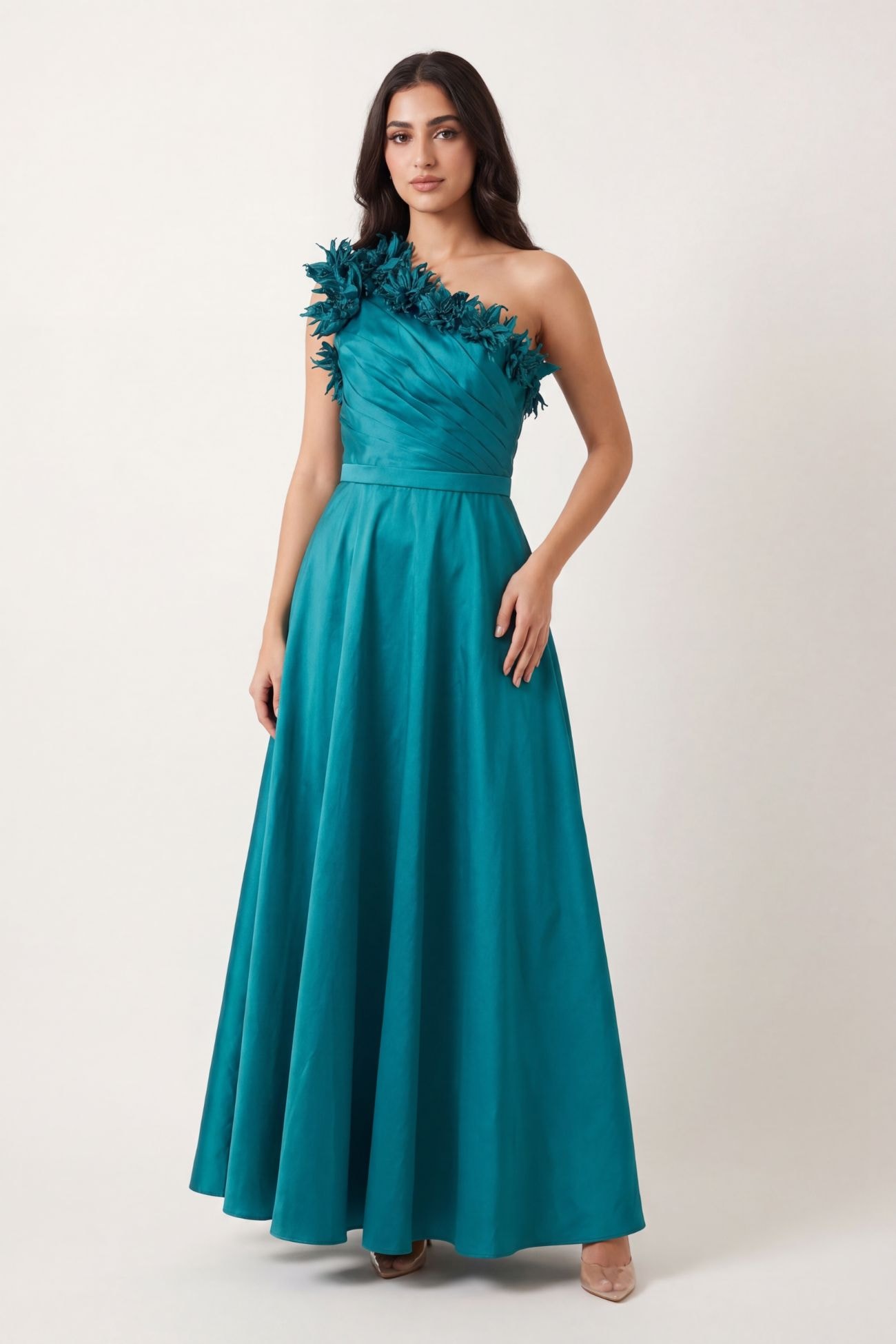 An elegant evening dress made of Indian silk, off-shoulder, with borders from the same fabric embellished with crystals.